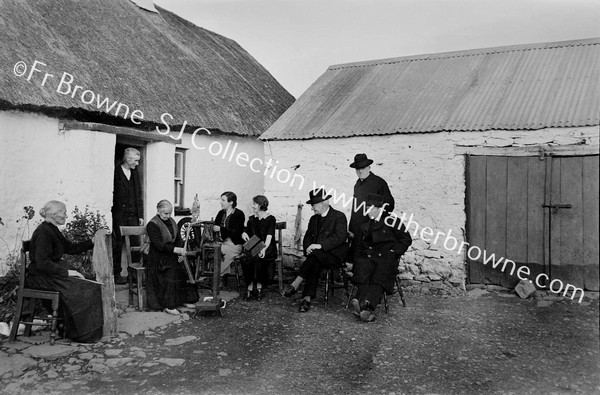 IN A COTTAGE HOUSE NEAR DRUMSHANBO WHERE THERE WAS HOME SPINNING  FR.CONEFREY & FR. GARAHY